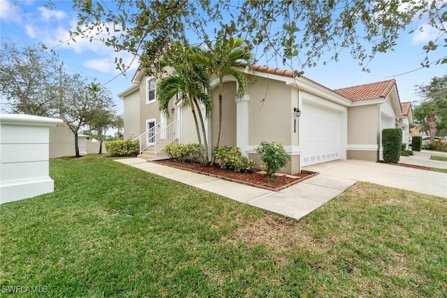 view of side of home featuring a garage and a lawn