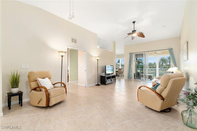 living room featuring ceiling fan and light tile patterned floors