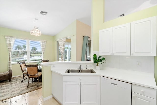 kitchen featuring sink, dishwasher, white cabinetry, and light tile patterned floors