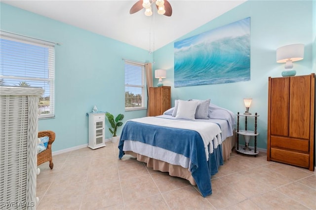 bedroom featuring lofted ceiling, tile patterned flooring, and ceiling fan