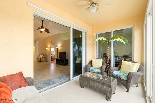 sunroom featuring ceiling fan