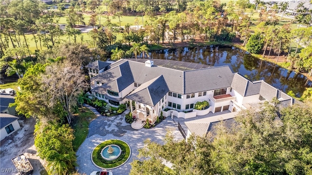 birds eye view of property with a water view