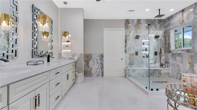 bathroom featuring vanity, tile walls, and tiled shower