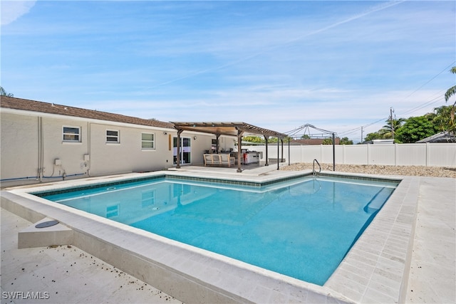 view of swimming pool with a patio area and a pergola