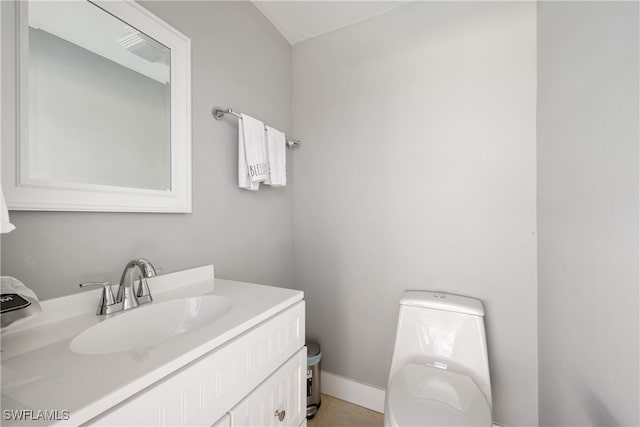 bathroom with toilet and vanity