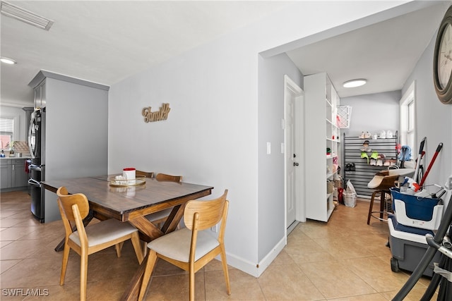 dining room featuring light tile patterned flooring