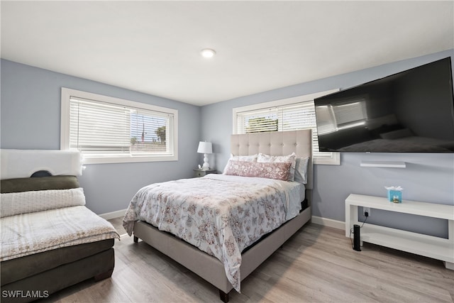 bedroom with light wood-type flooring