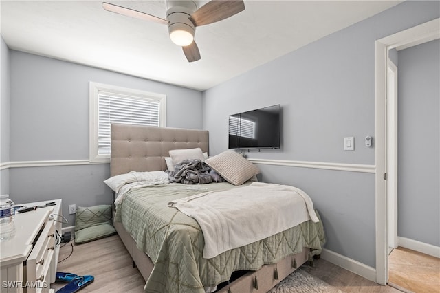 bedroom featuring light wood-type flooring and ceiling fan