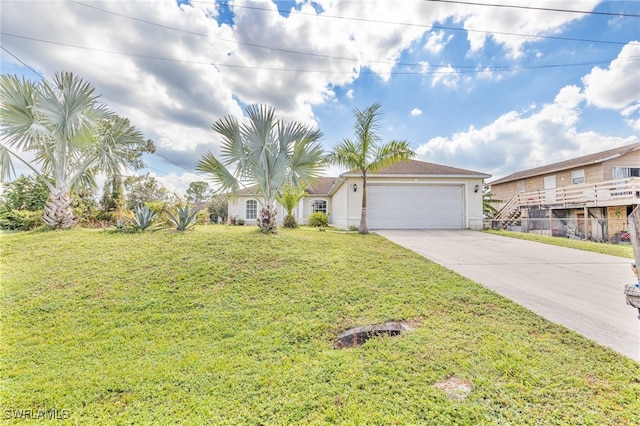 view of front of property featuring a front yard and a garage