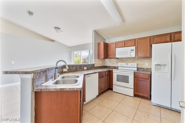 kitchen featuring white appliances, tasteful backsplash, sink, kitchen peninsula, and light tile patterned floors