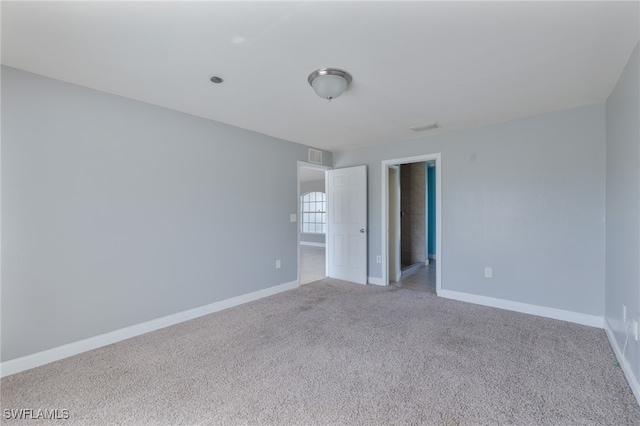 spare room with carpet floors