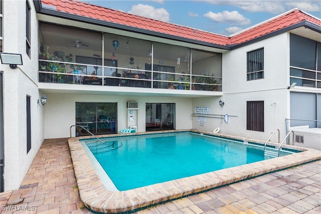 view of swimming pool with a patio