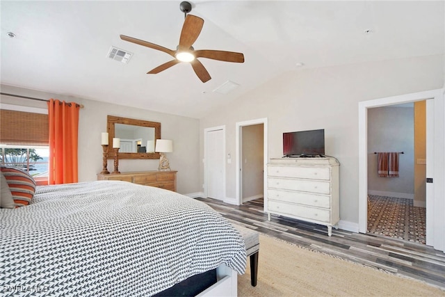 bedroom featuring connected bathroom, ceiling fan, wood-type flooring, and lofted ceiling