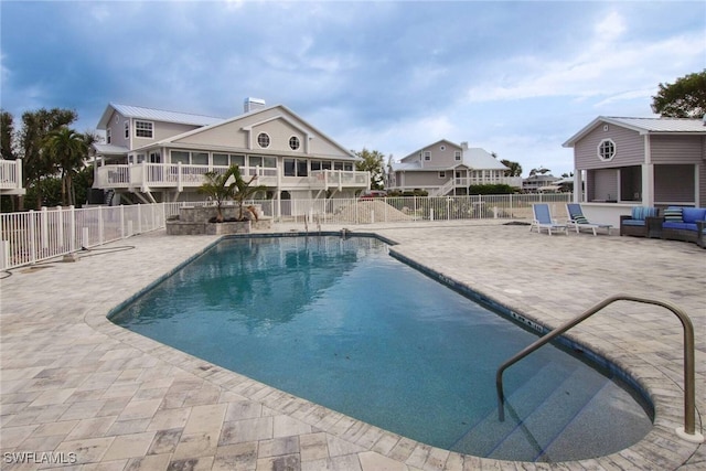 view of pool featuring a patio area