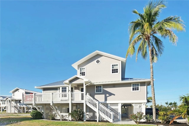 back of house with a carport