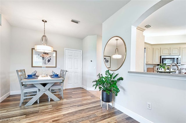 dining area with hardwood / wood-style flooring