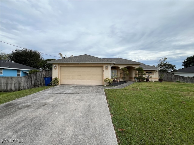 ranch-style house with a garage and a front lawn