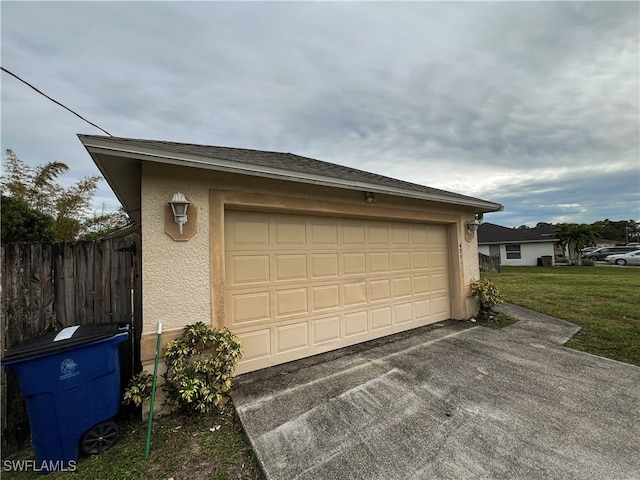 garage featuring a yard