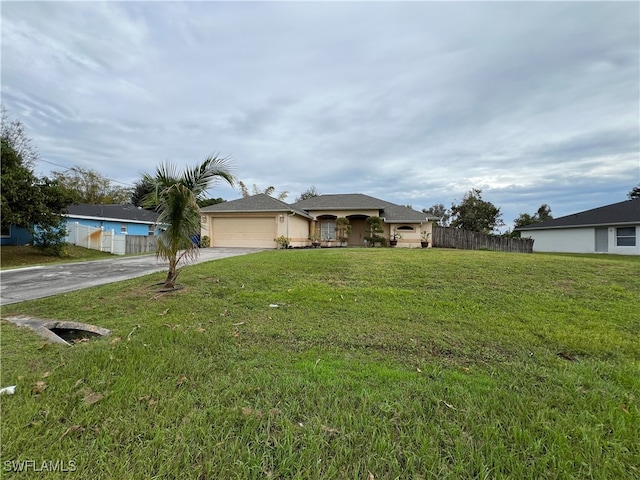 ranch-style home with a front lawn and a garage