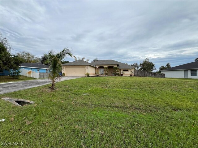 4895 Golfview Blvd, Lehigh Acres, FL 33973 - ranch-style home featuring concrete driveway, a garage, and stucco siding
