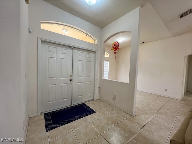 foyer featuring light tile patterned floors