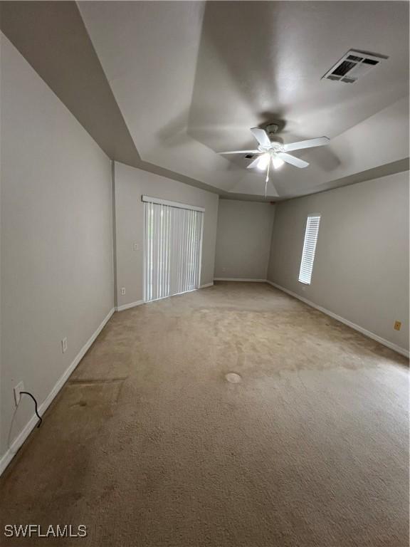4895 Golfview Blvd, Lehigh Acres, FL 33973 - carpeted spare room featuring a ceiling fan and baseboards