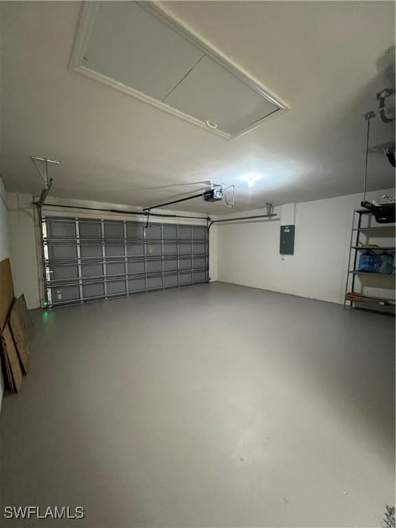 4895 Golfview Blvd, Lehigh Acres, FL 33973 - garage with a garage door opener and electric panel