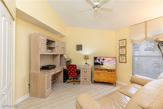 office with light hardwood / wood-style floors and ceiling fan