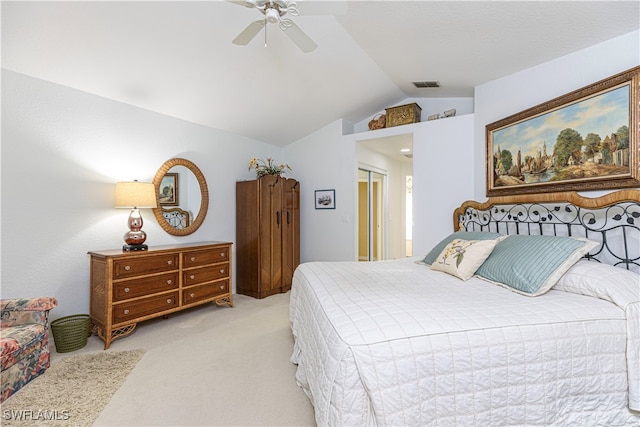 bedroom featuring lofted ceiling, light carpet, and ceiling fan