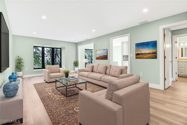 living room with light hardwood / wood-style floors