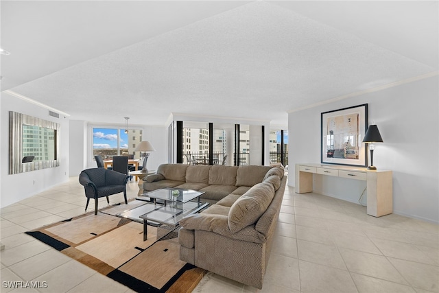 living room featuring crown molding, plenty of natural light, light tile patterned floors, and a textured ceiling