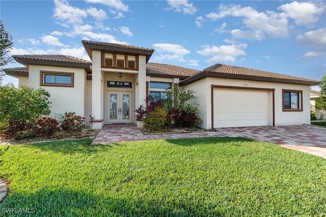 1200 SW 38th St, Cape Coral, FL 33914 - mediterranean / spanish-style house with french doors, decorative driveway, a garage, and stucco siding