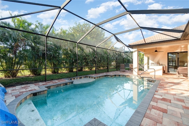 view of pool featuring a patio, a lanai, and ceiling fan