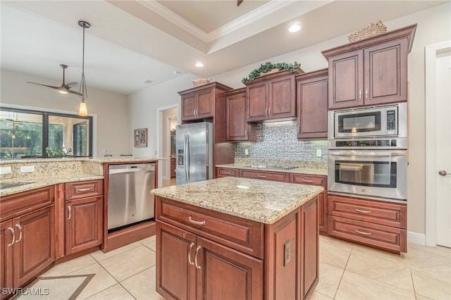 kitchen with a raised ceiling, decorative backsplash, appliances with stainless steel finishes, ornamental molding, and light tile patterned flooring