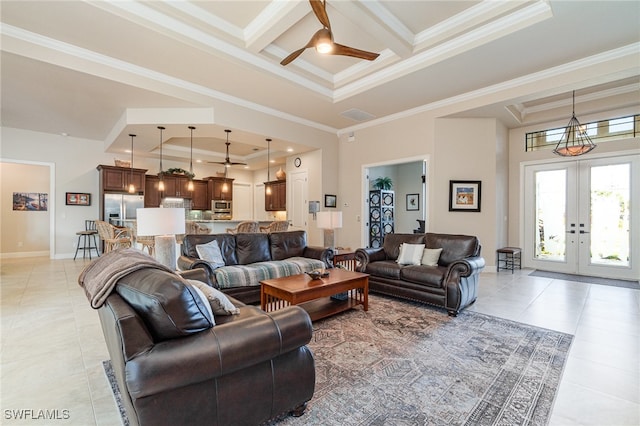 living room featuring light tile patterned floors, ornamental molding, a raised ceiling, and french doors