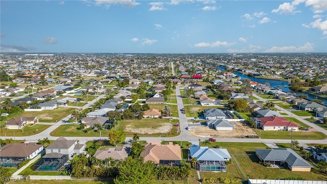 aerial view featuring a water view and a residential view