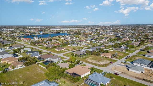 aerial view with a water view and a residential view