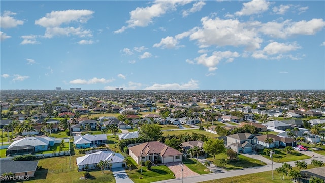 birds eye view of property with a residential view