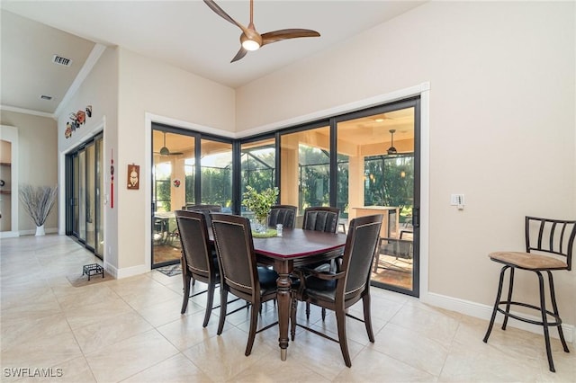 1200 SW 38th St, Cape Coral, FL 33914 - dining room with a ceiling fan, crown molding, healthy amount of natural light, and light tile patterned floors