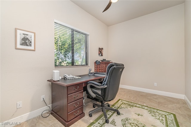 office area featuring baseboards and a ceiling fan