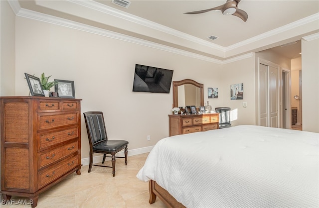 bedroom with ornamental molding, a closet, visible vents, and baseboards