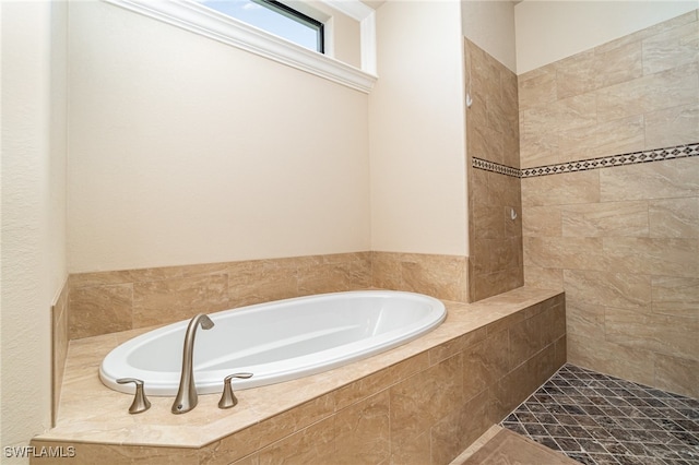 full bathroom featuring a garden tub