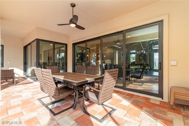 view of patio with ceiling fan and outdoor dining space