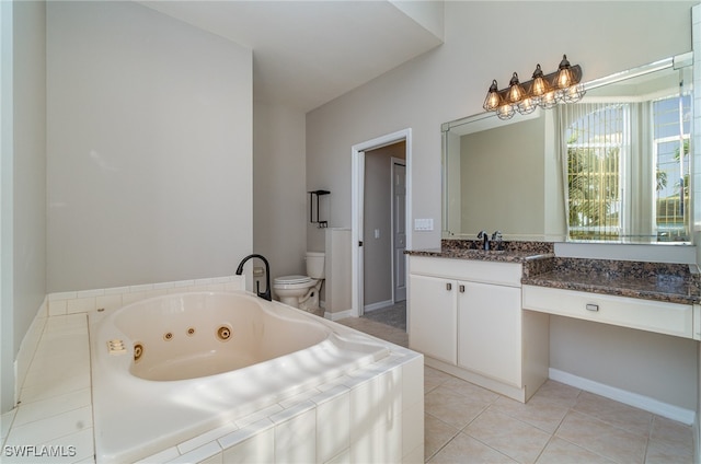 bathroom featuring vanity, tiled bath, toilet, and tile patterned flooring