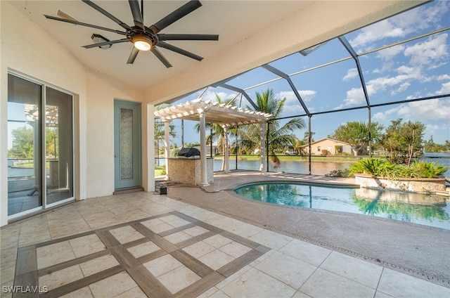 view of swimming pool featuring a patio area, a lanai, and ceiling fan