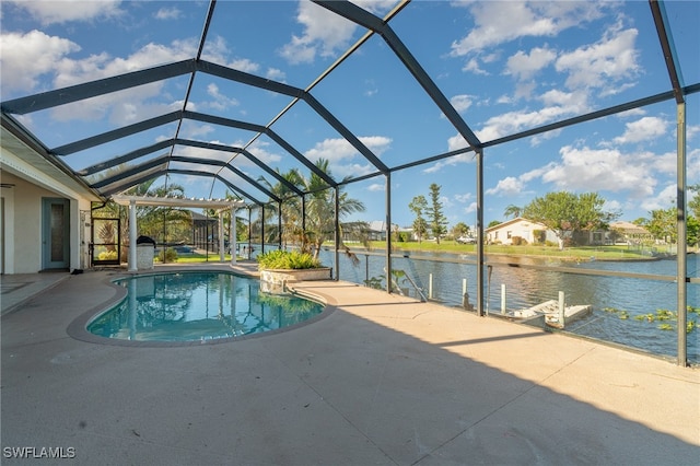 view of pool with a patio area, a water view, and glass enclosure