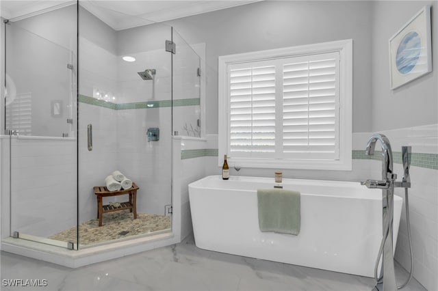 bathroom with tile walls, independent shower and bath, and crown molding