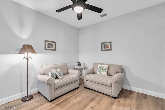 sitting room featuring ceiling fan and light hardwood / wood-style flooring