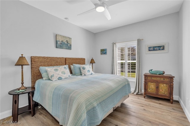 bedroom featuring light hardwood / wood-style floors and ceiling fan