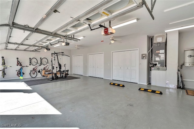 garage with a garage door opener, heating unit, gas water heater, and ceiling fan